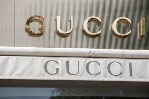 gucci is owned by.